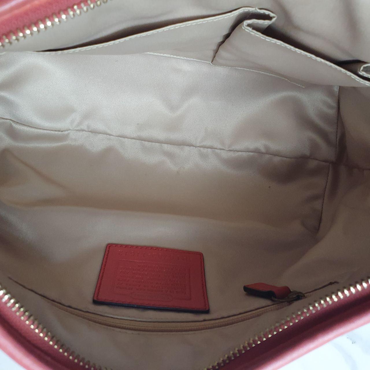 Authentic vintage Coach shoulder orange hobo bag.