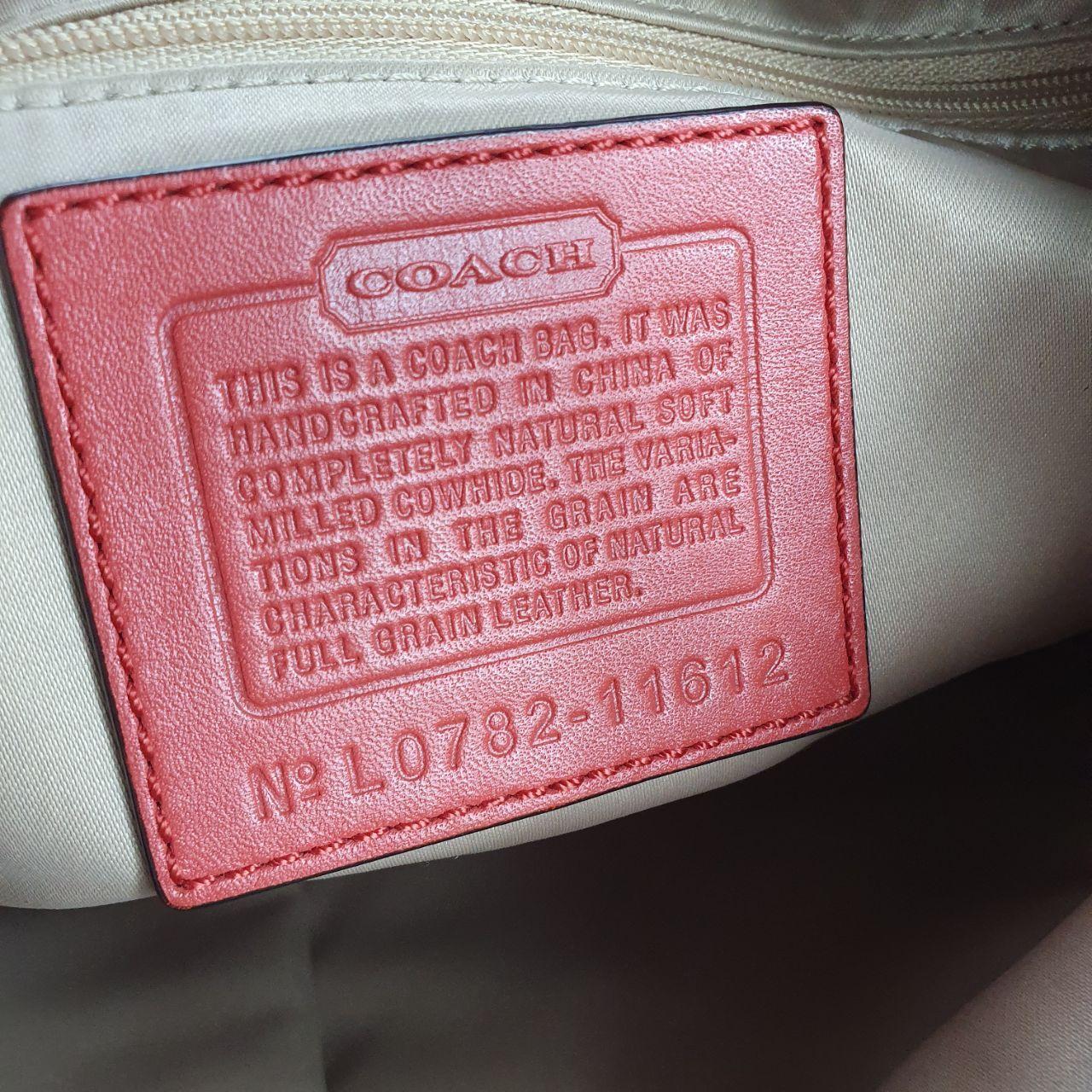 Authentic vintage Coach shoulder orange hobo bag.