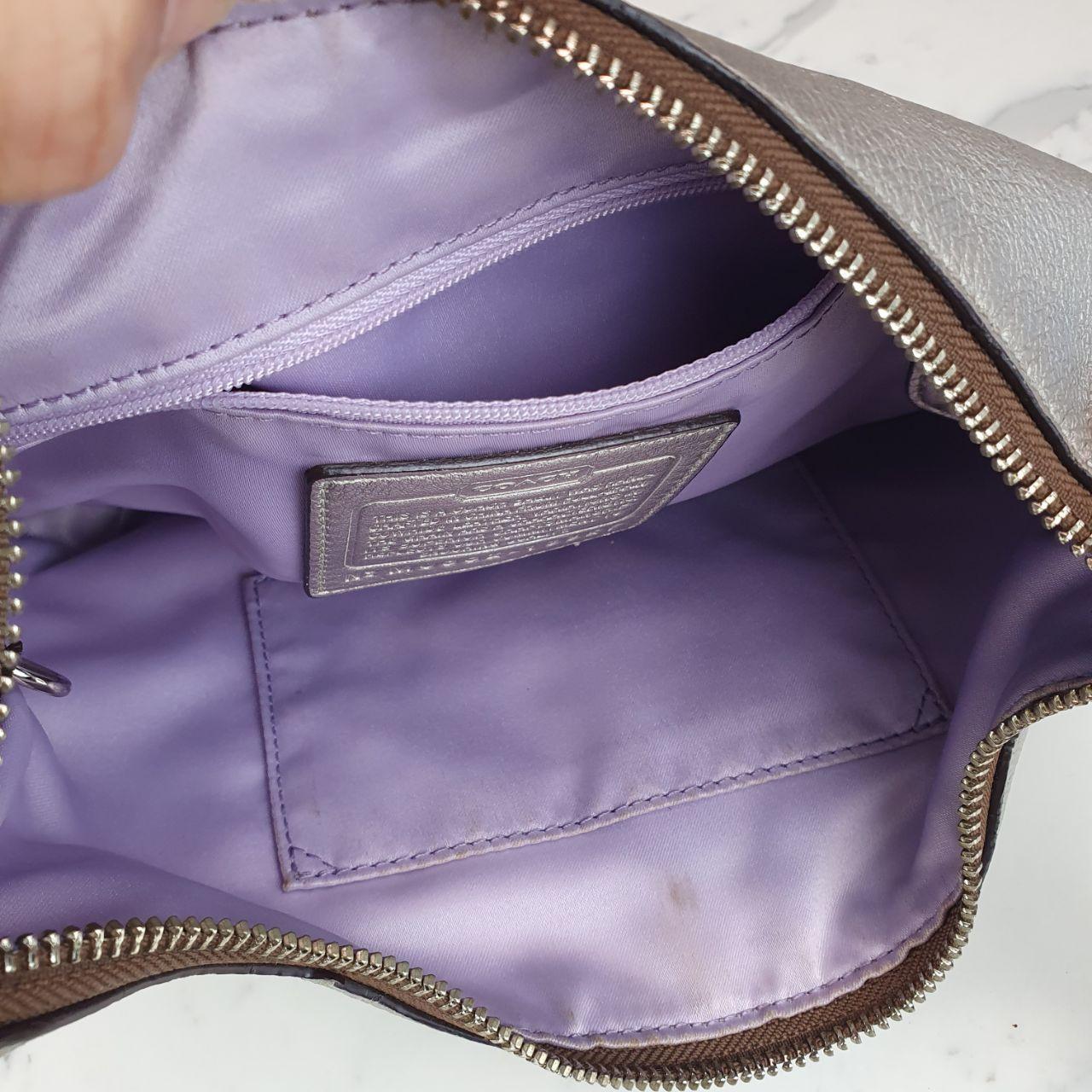 Authentic Coach Penelope  hobo purse in metallic silver champagne