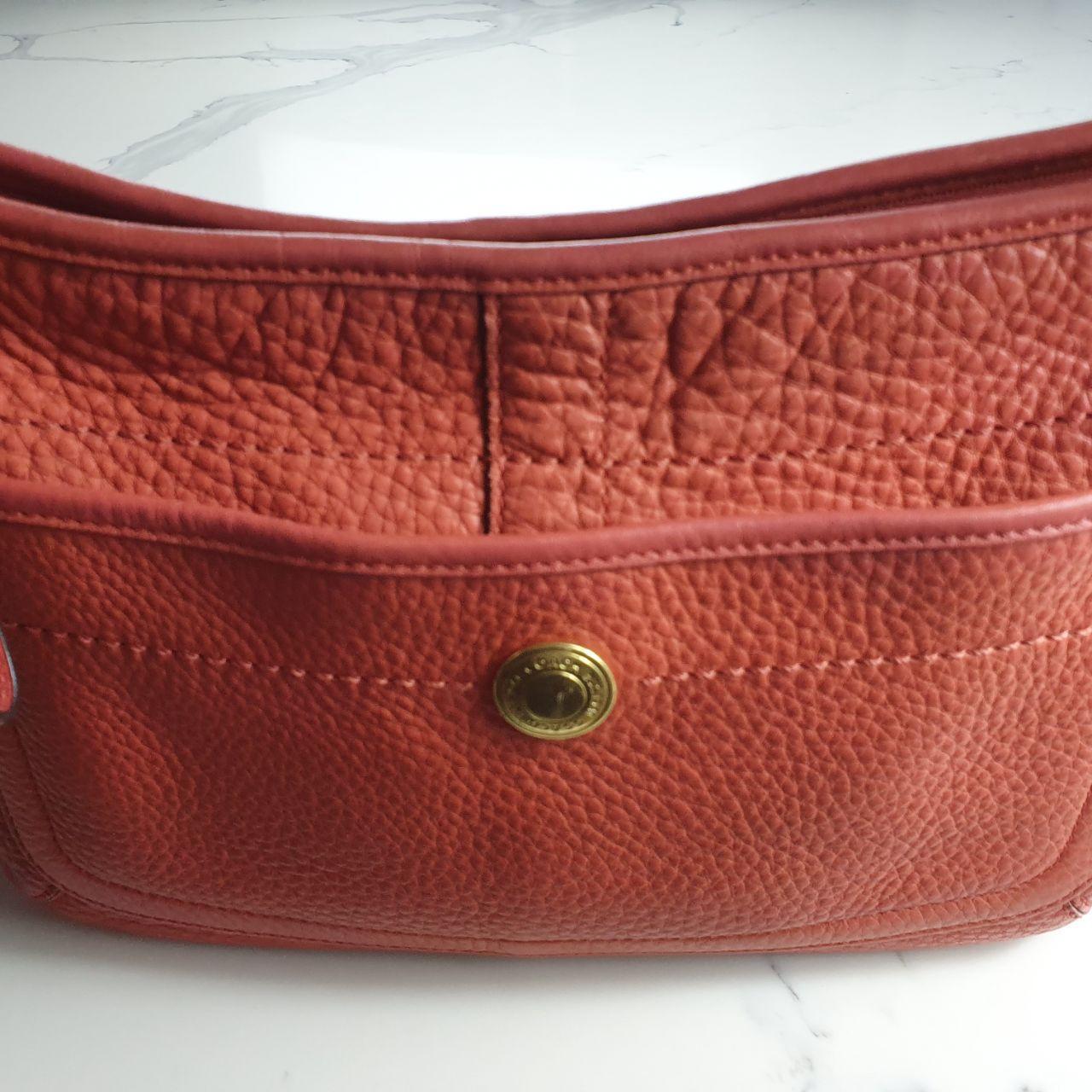 Authentic vintage Coach shoulder orange hobo bag.