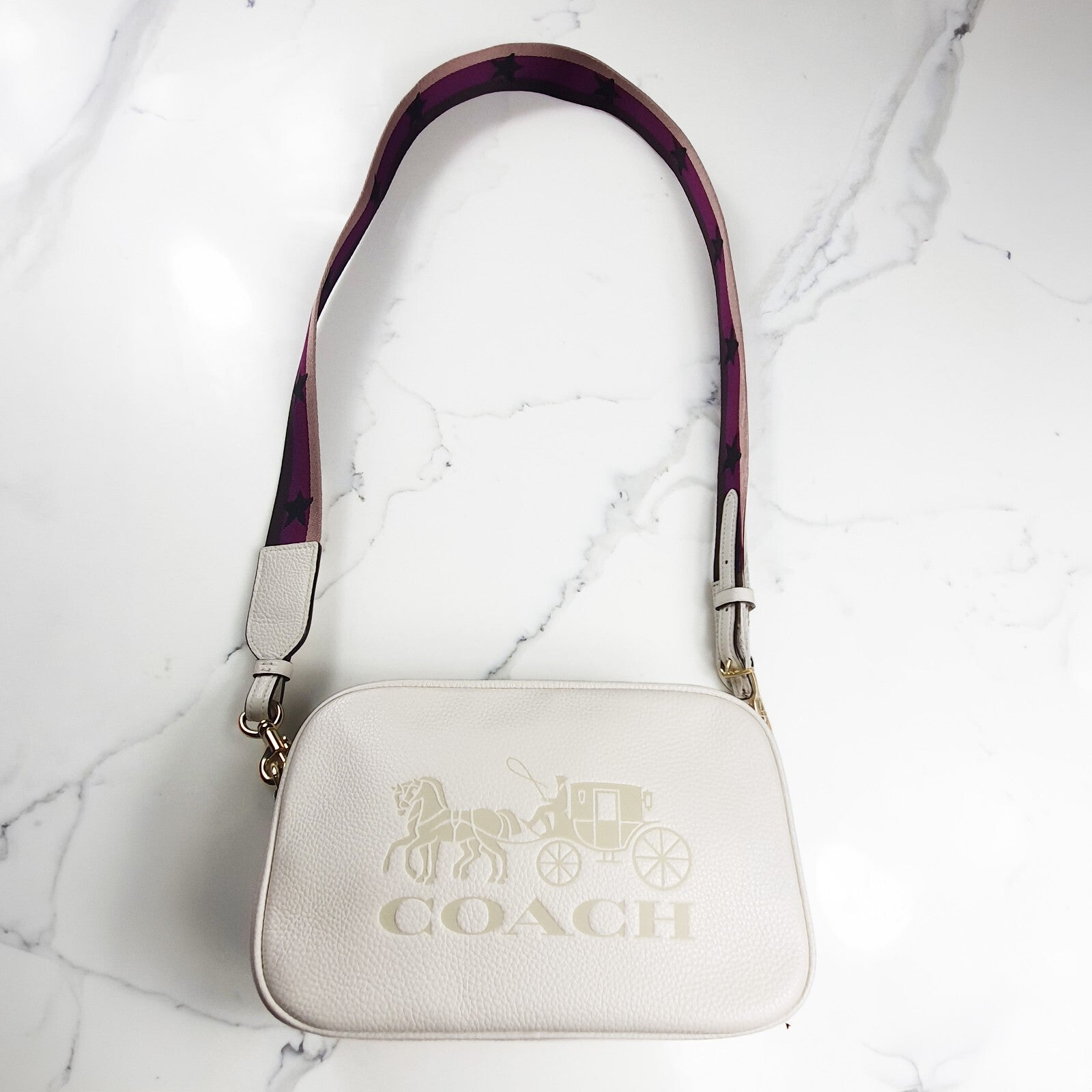 Authentic brand new Coach white leather crossbody bag with purple star strap