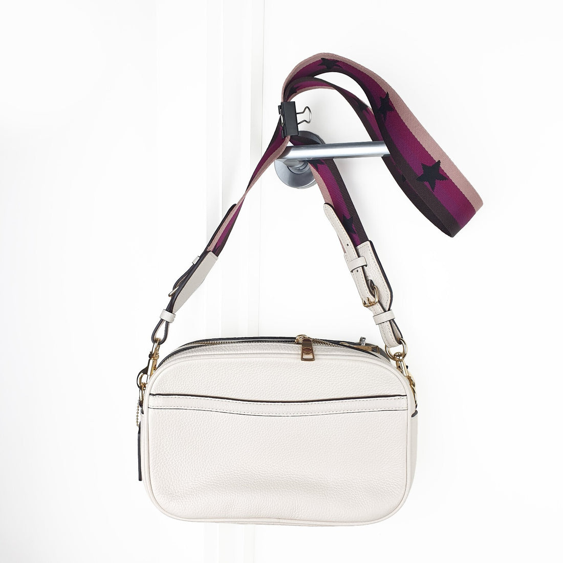 Authentic brand new Coach white leather crossbody bag with purple star strap