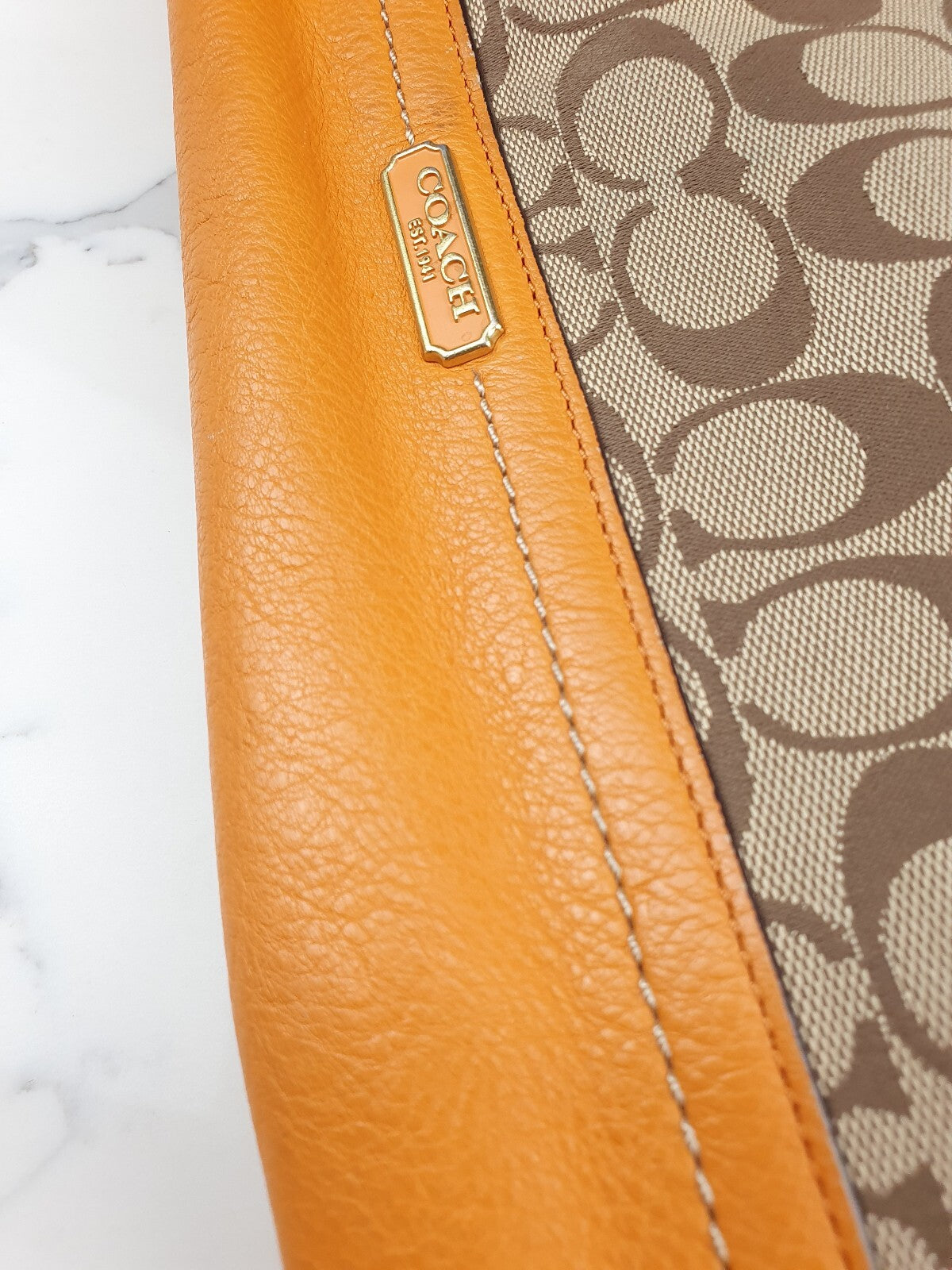 Coach Signature Canvas and Genuine Leather Tote Bag in Tan and Orange