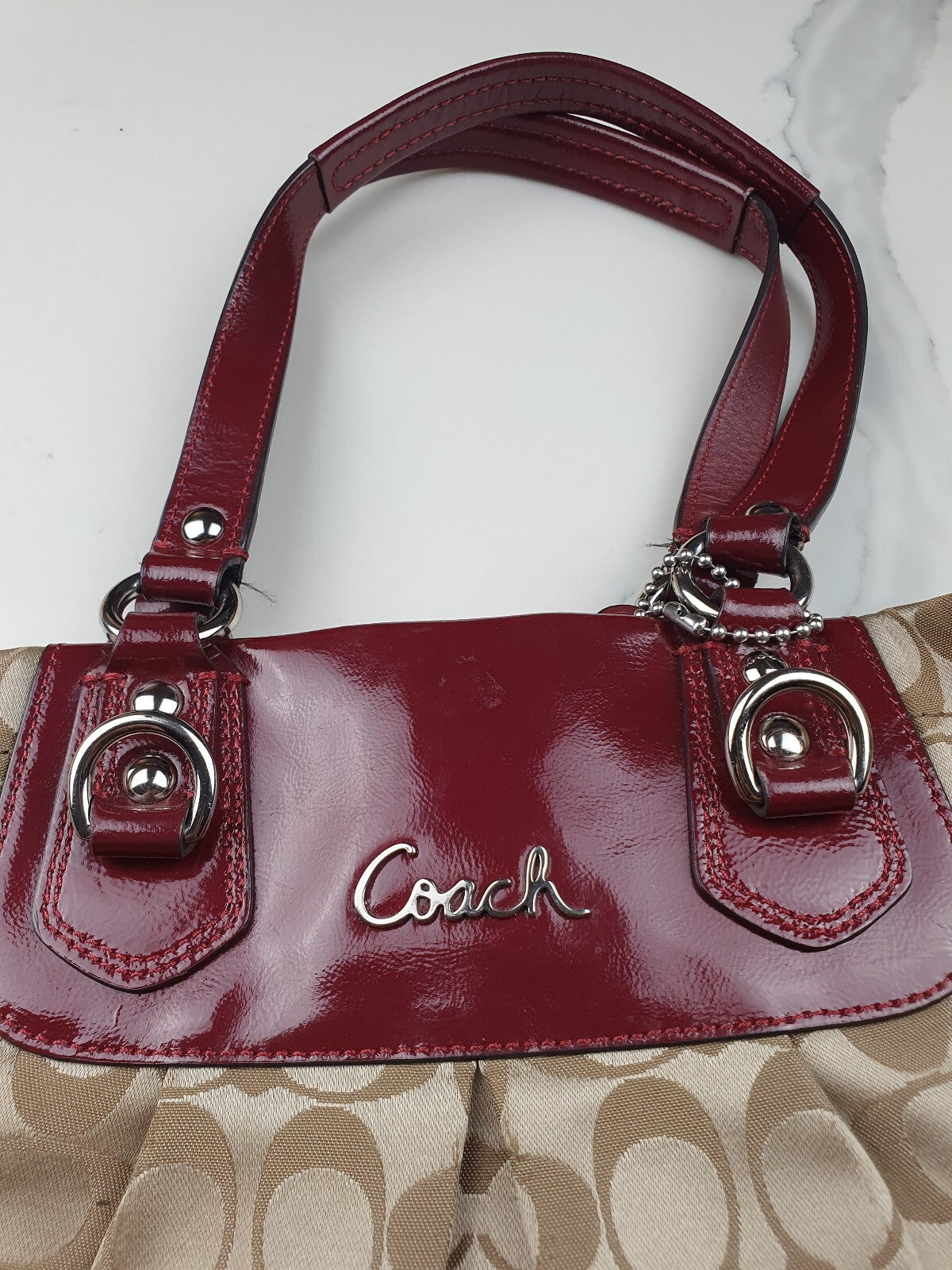 Coach Signature Canvas Tote Bag with Burgundy Patent Leather Trim