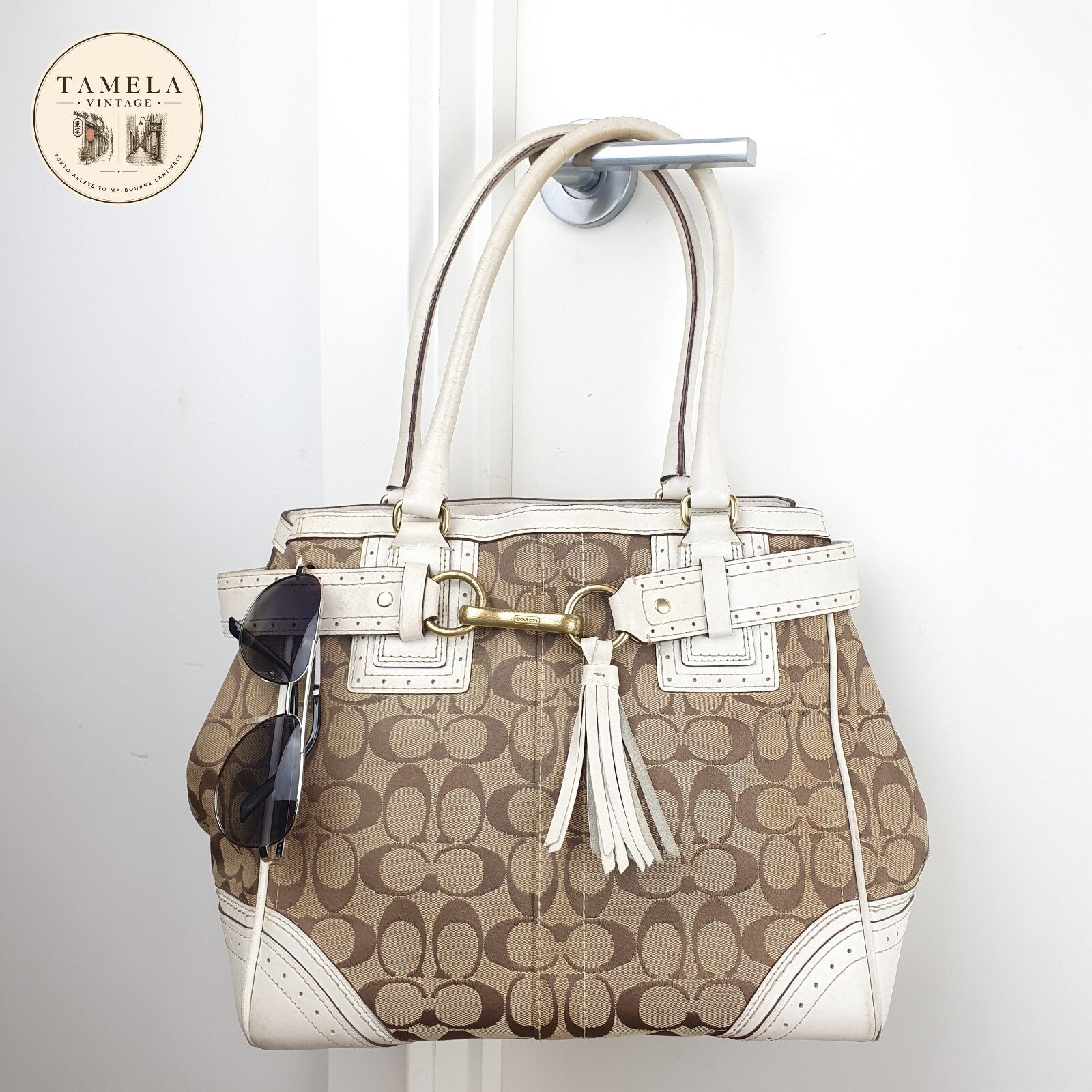 Coach Signature Canvas and Leather Tote Bag with Tassel Detail