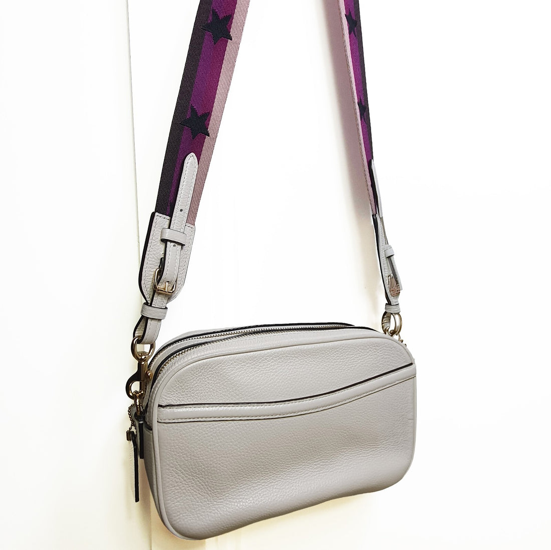 Authentic brand new Coach white leather crossbody bag with purple star strap