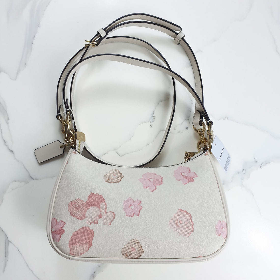 Authentic brand new with tag Coach white and pink floral print terri mini purse.