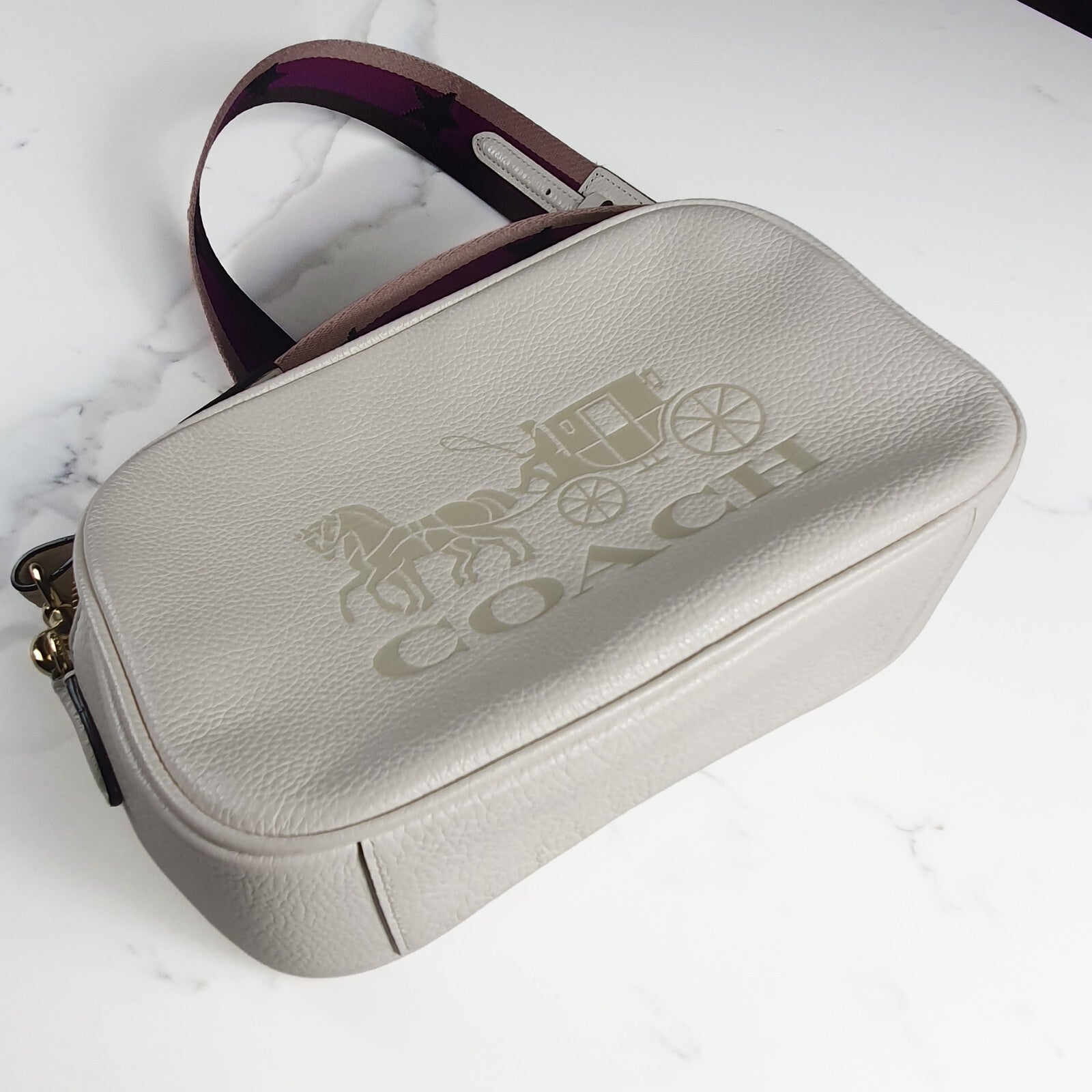 Authentic brand new Coach white leather crossbody bag with purple star strap