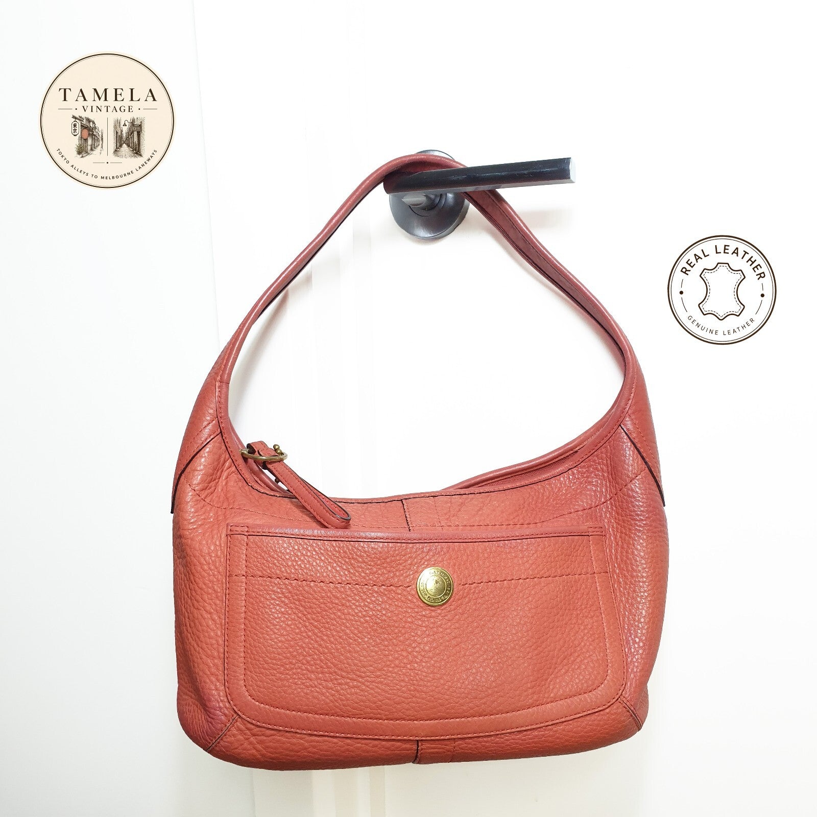 Authentic vintage Coach shoulder orange hobo bag.