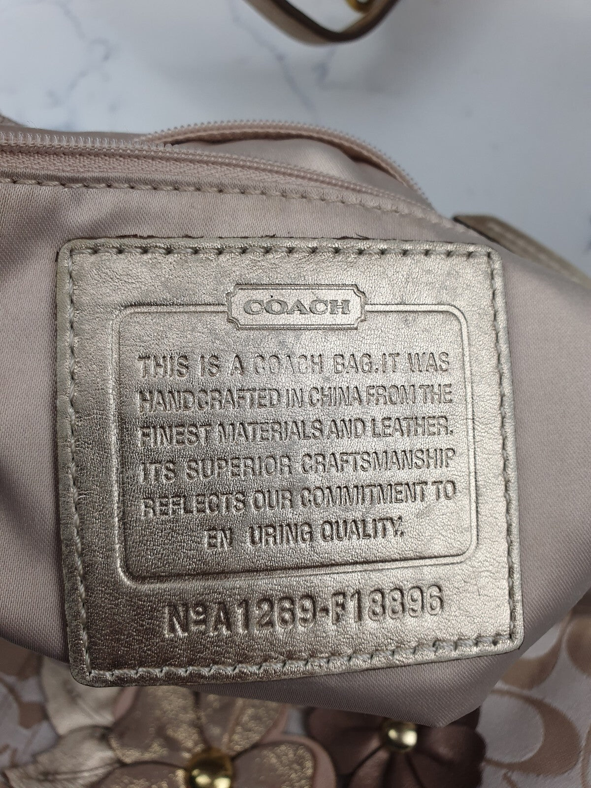 Coach Signature Canvas Shoulder Bag with Floral Appliqué