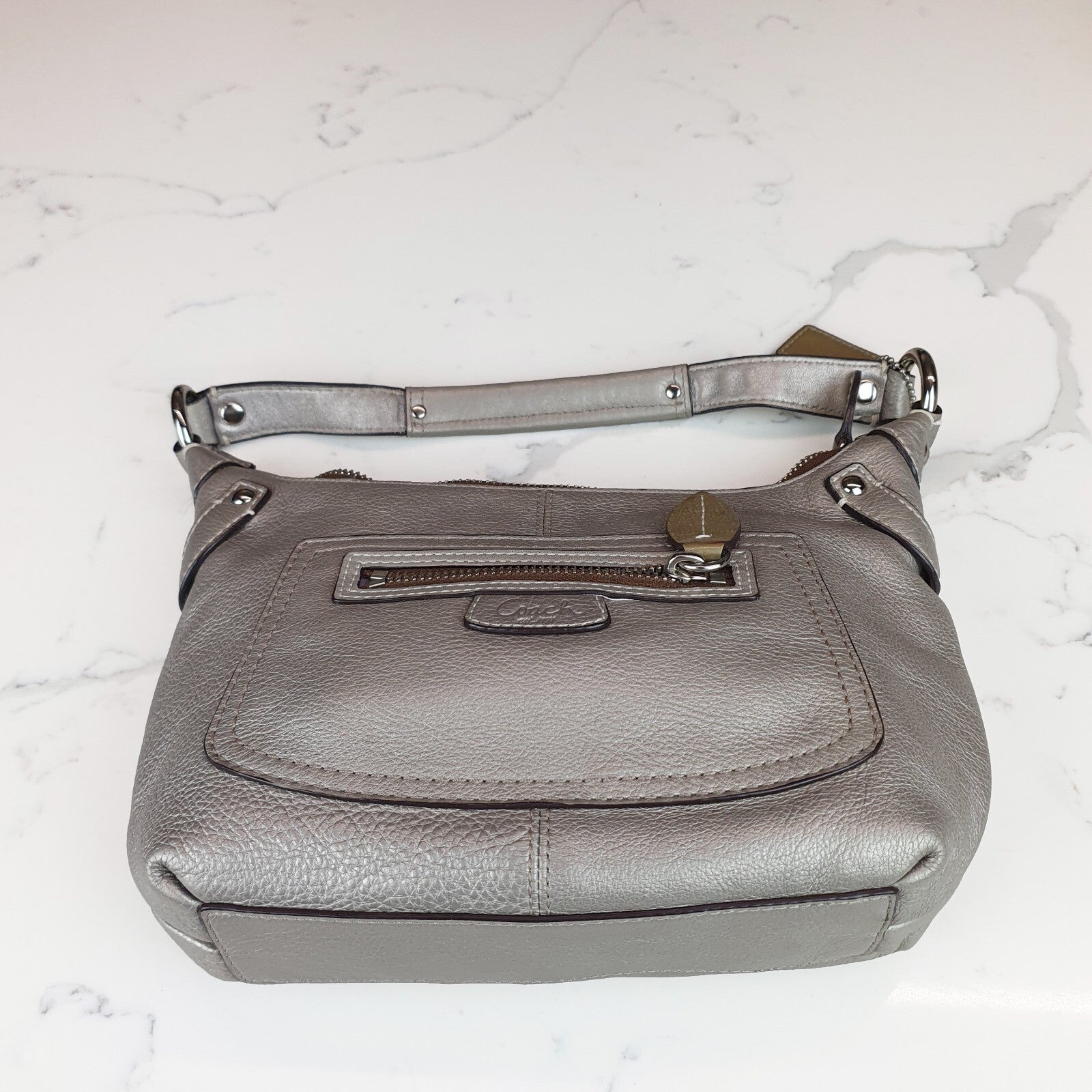 Authentic Coach Penelope  hobo purse in metallic silver champagne