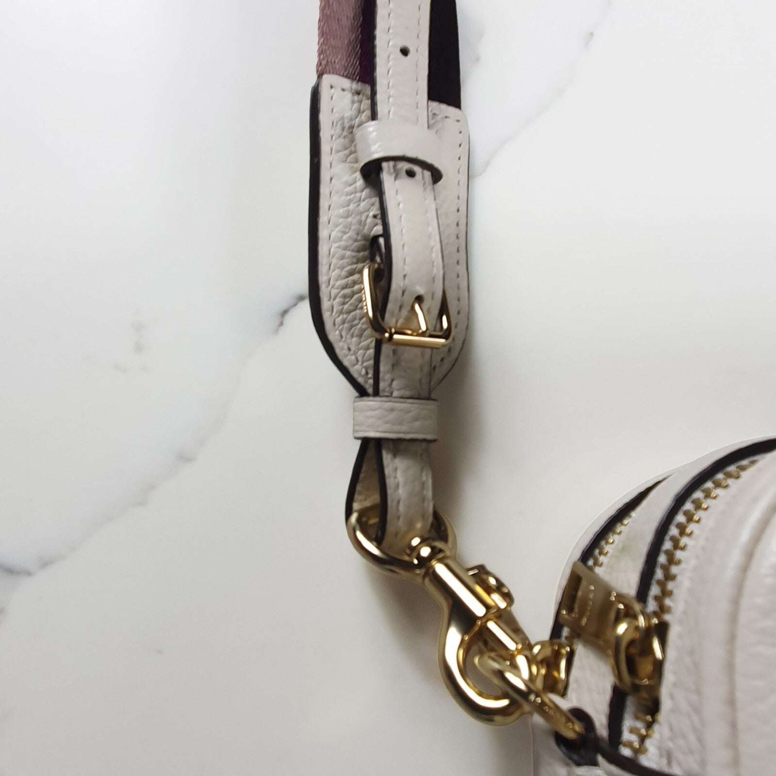 Authentic brand new Coach white leather crossbody bag with purple star strap