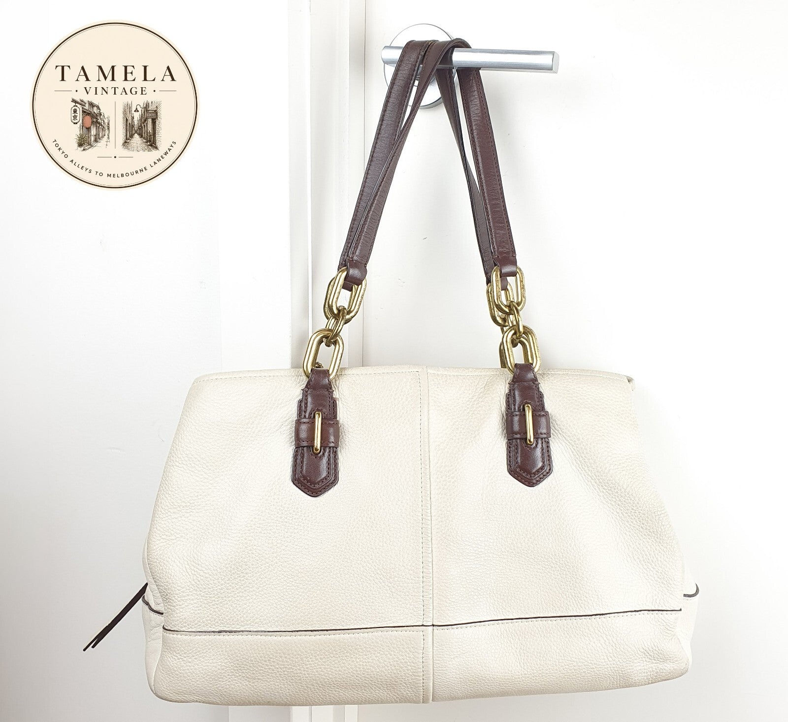 Coach Genuine Leather Handbag with Gold Hardware and Brown Strap
