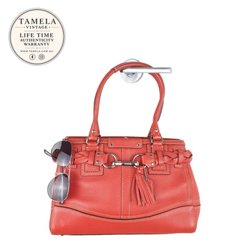 Coach Vintage Orange Leather Shoulder Bag with Braided Detail and Tassel