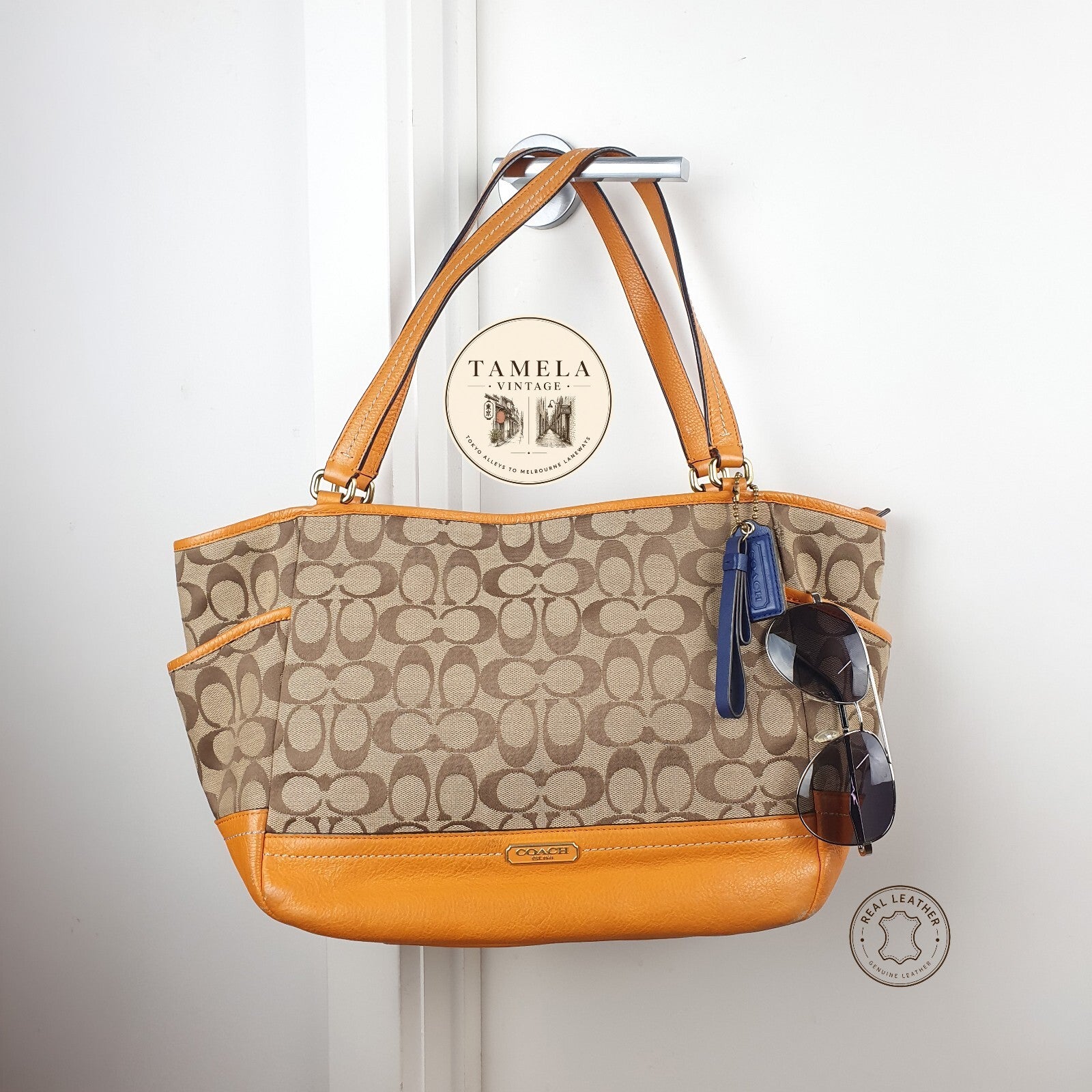 Coach Signature Canvas and Genuine Leather Tote Bag in Tan and Orange
