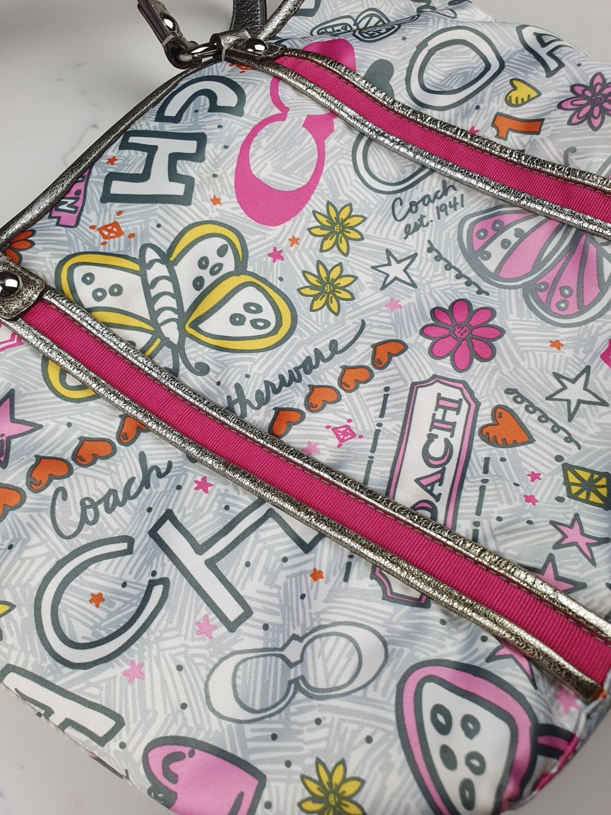 Coach Handbag with Colorful Butterfly and Logo Print