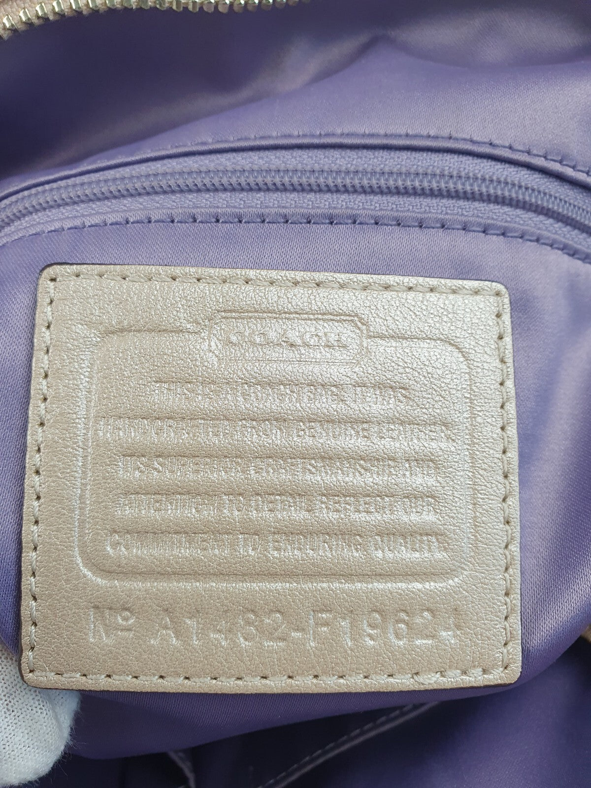 Coach Beige Leather Tote Bag with Floral Cutout Design