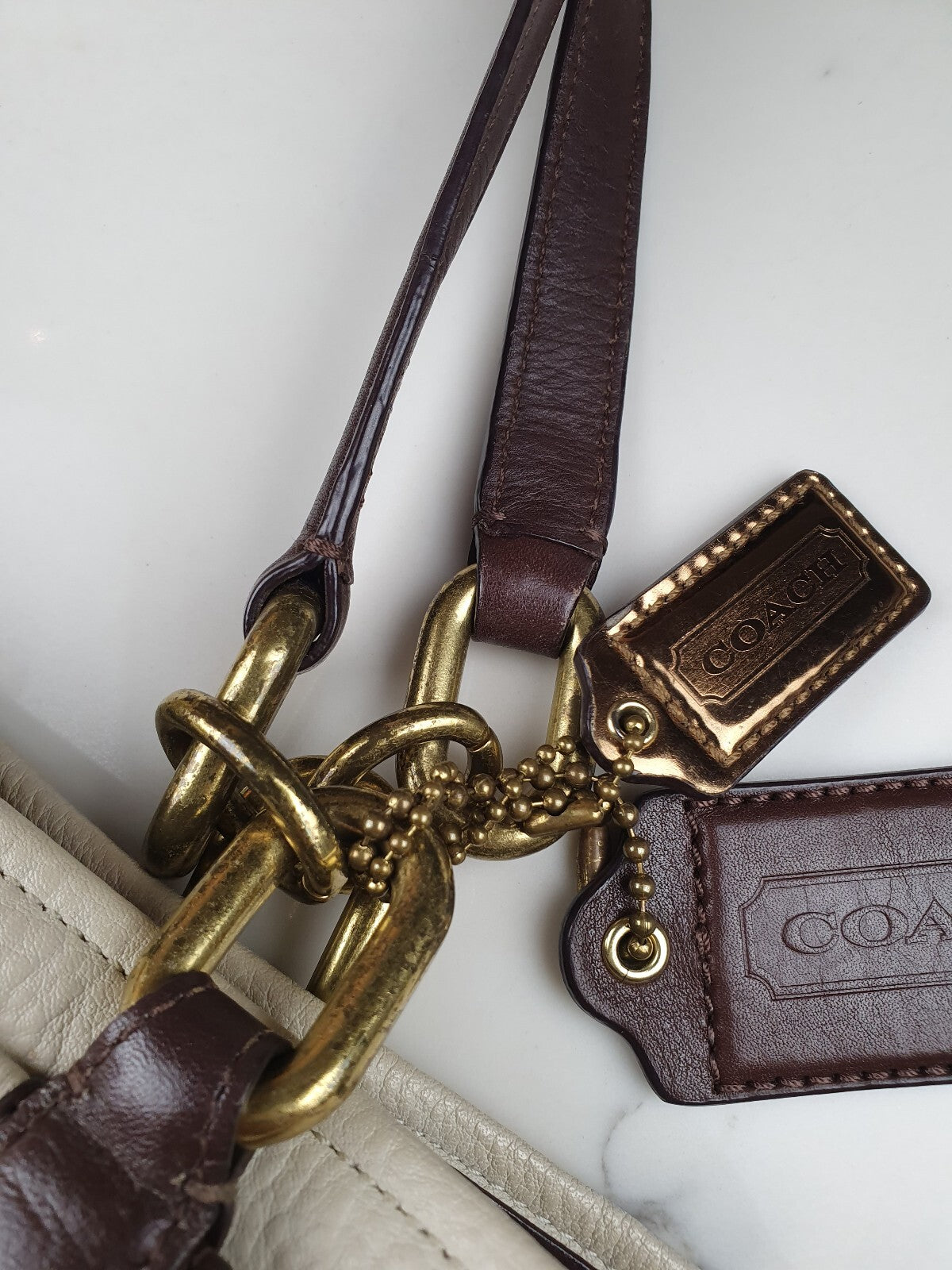 Coach Genuine Leather Handbag with Gold Hardware and Brown Strap
