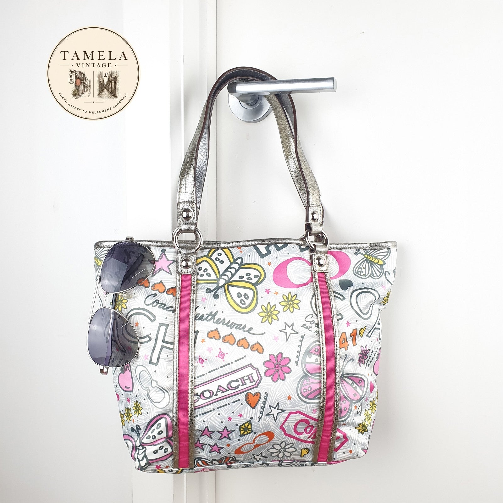 Coach Handbag with Colorful Butterfly and Logo Print
