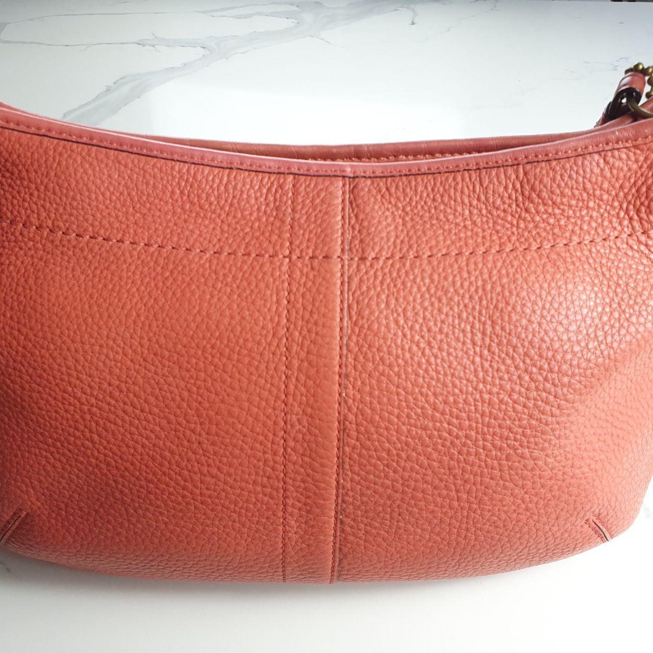 Authentic vintage Coach shoulder orange hobo bag.